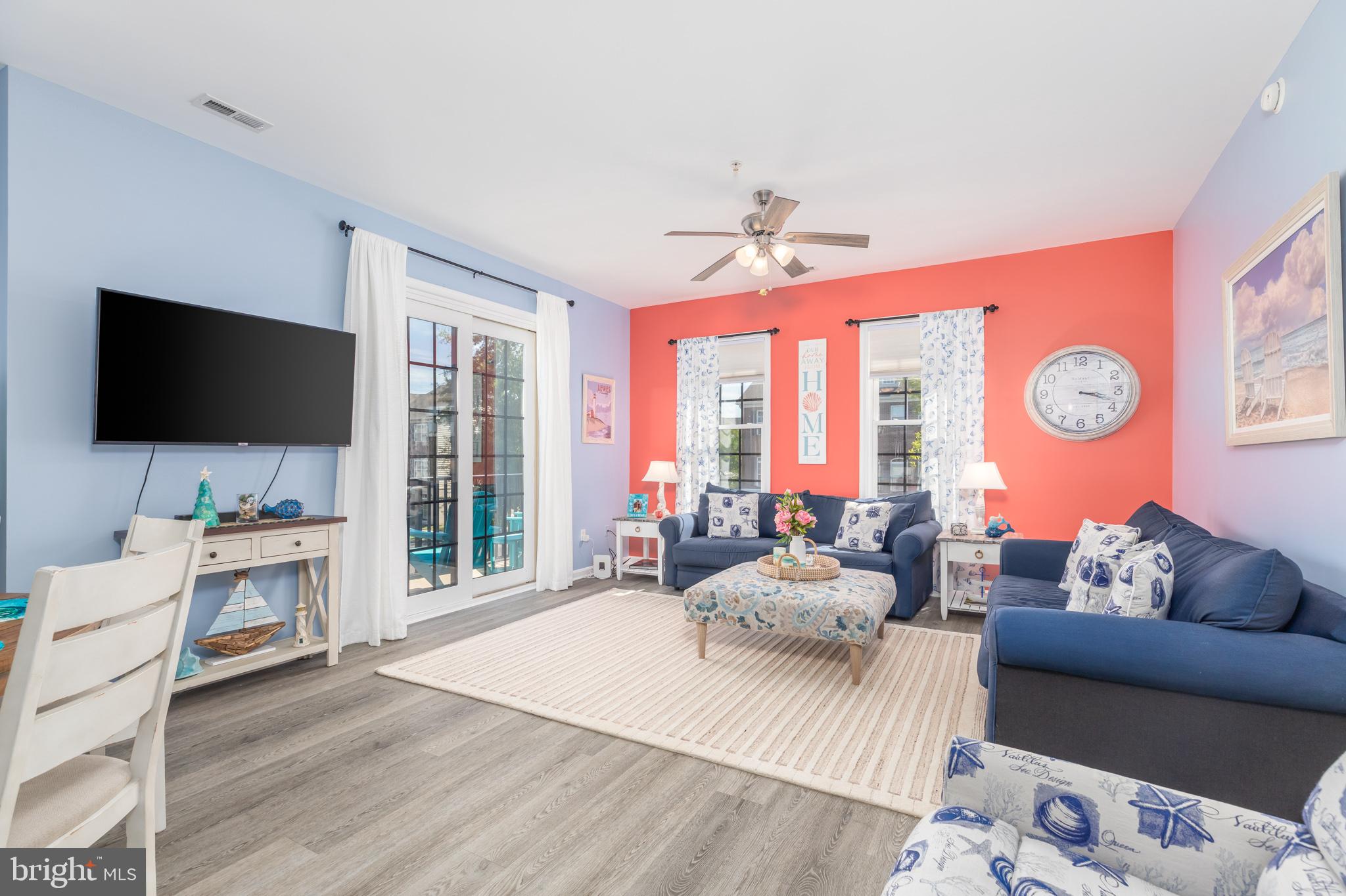 17300 North Village Main Boulevard, Unit 66 Lewes, DE 19958 - Photo 11 of 38 a living room with furniture and a flat screen tv