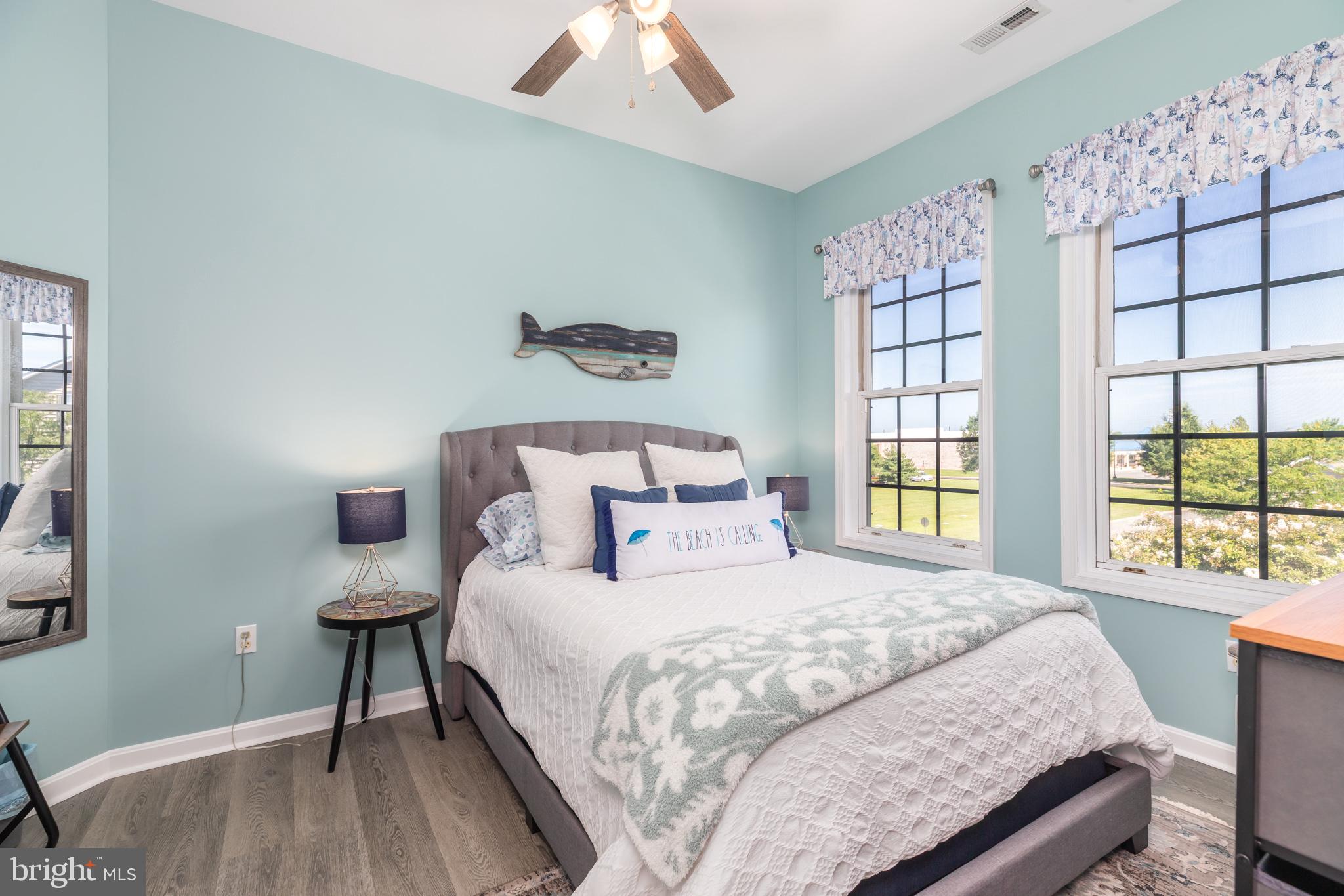 17300 North Village Main Boulevard, Unit 66 Lewes, DE 19958 - Photo 16 of 38 a bedroom with a bed and a window