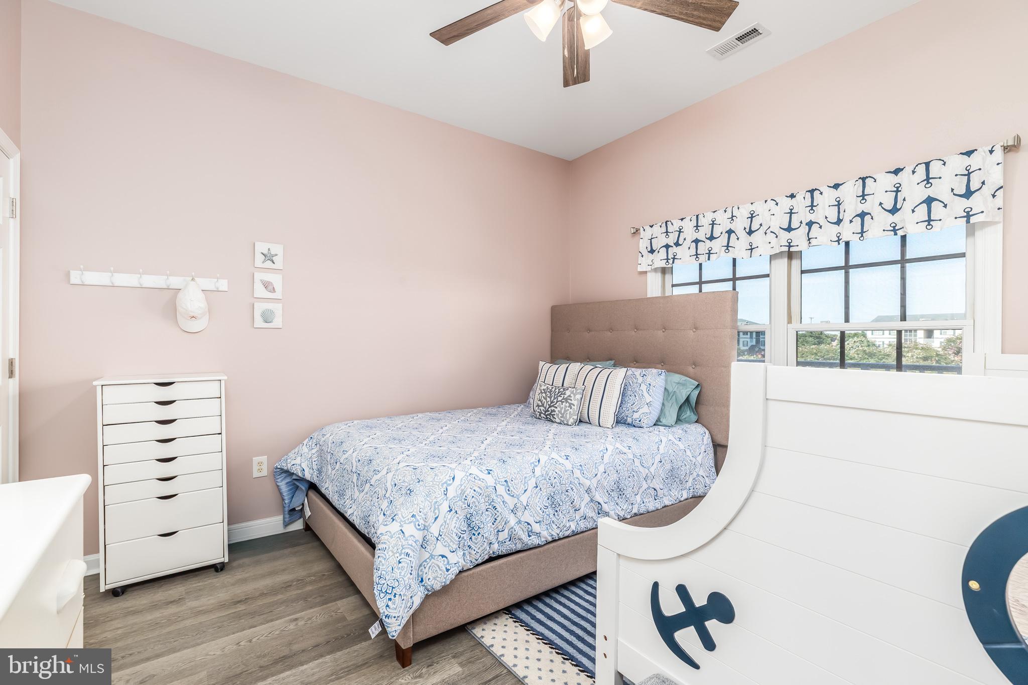 17300 North Village Main Boulevard, Unit 66 Lewes, DE 19958 - Photo 18 of 38 a bedroom with a bed and a window