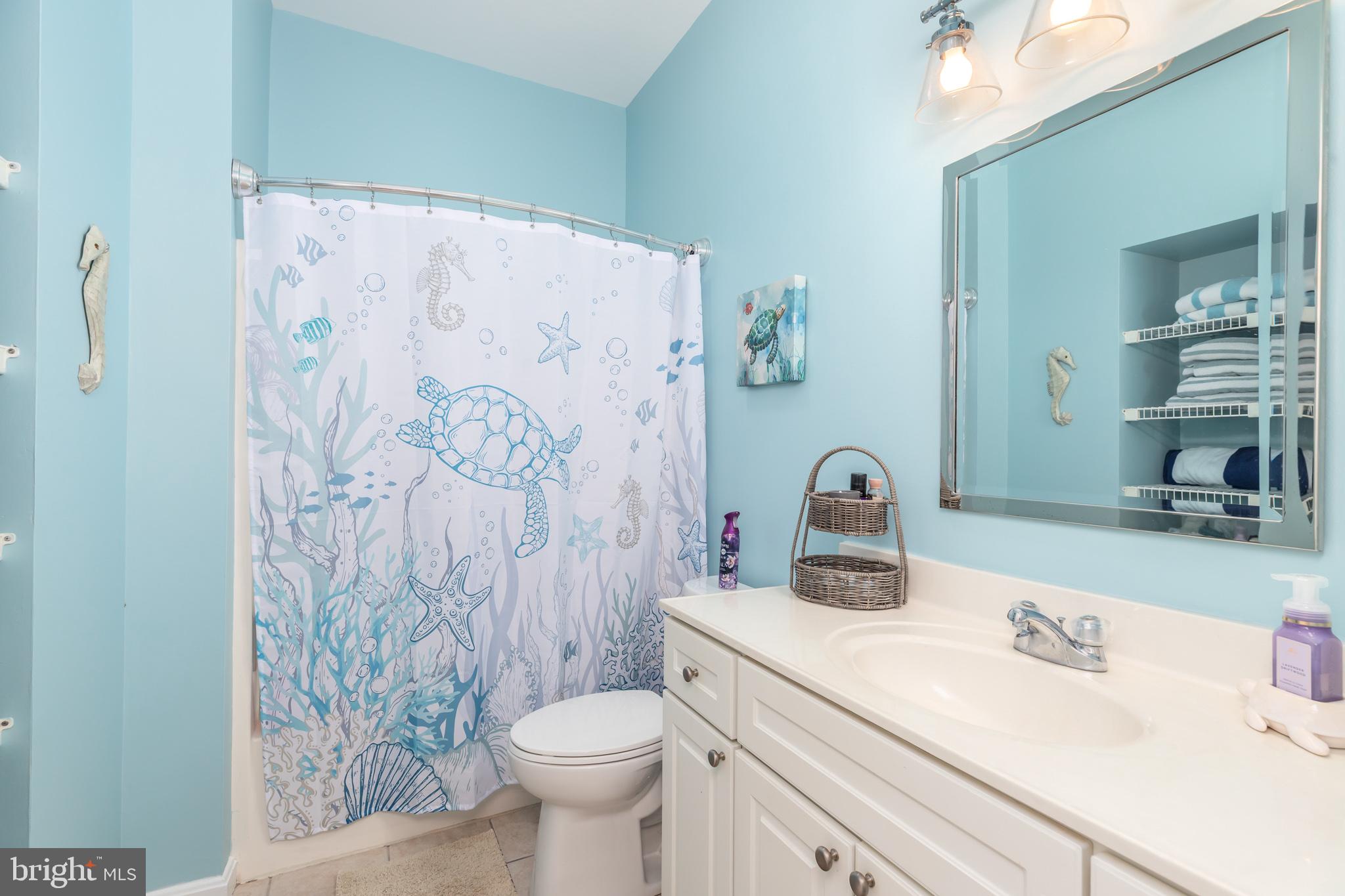 17300 North Village Main Boulevard, Unit 66 Lewes, DE 19958 - Photo 20 of 38 a bathroom with a sink toilet and shower