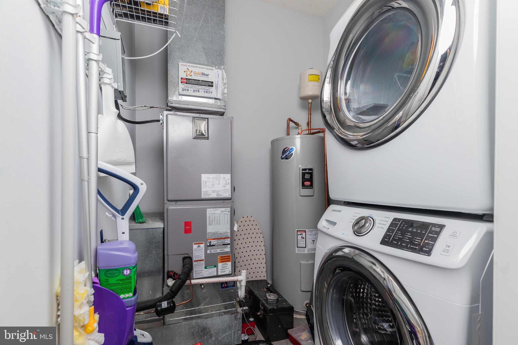 17300 North Village Main Boulevard, Unit 66 Lewes, DE 19958 - Photo 22 of 38 a utility room with dryer and washer
