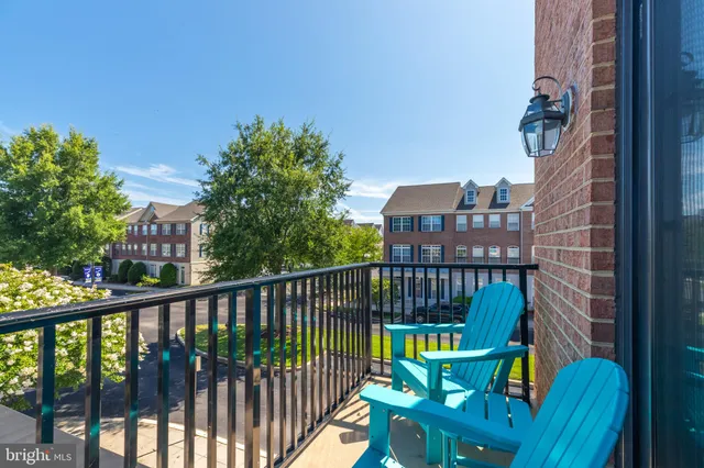 an aerial view of residential building with parking
