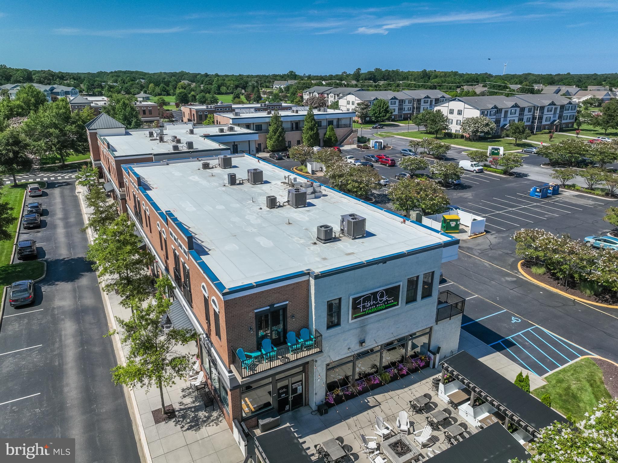 17300 North Village Main Boulevard, Unit 66 Lewes, DE 19958 - Photo 38 of 38 an aerial view of a house with a yard
