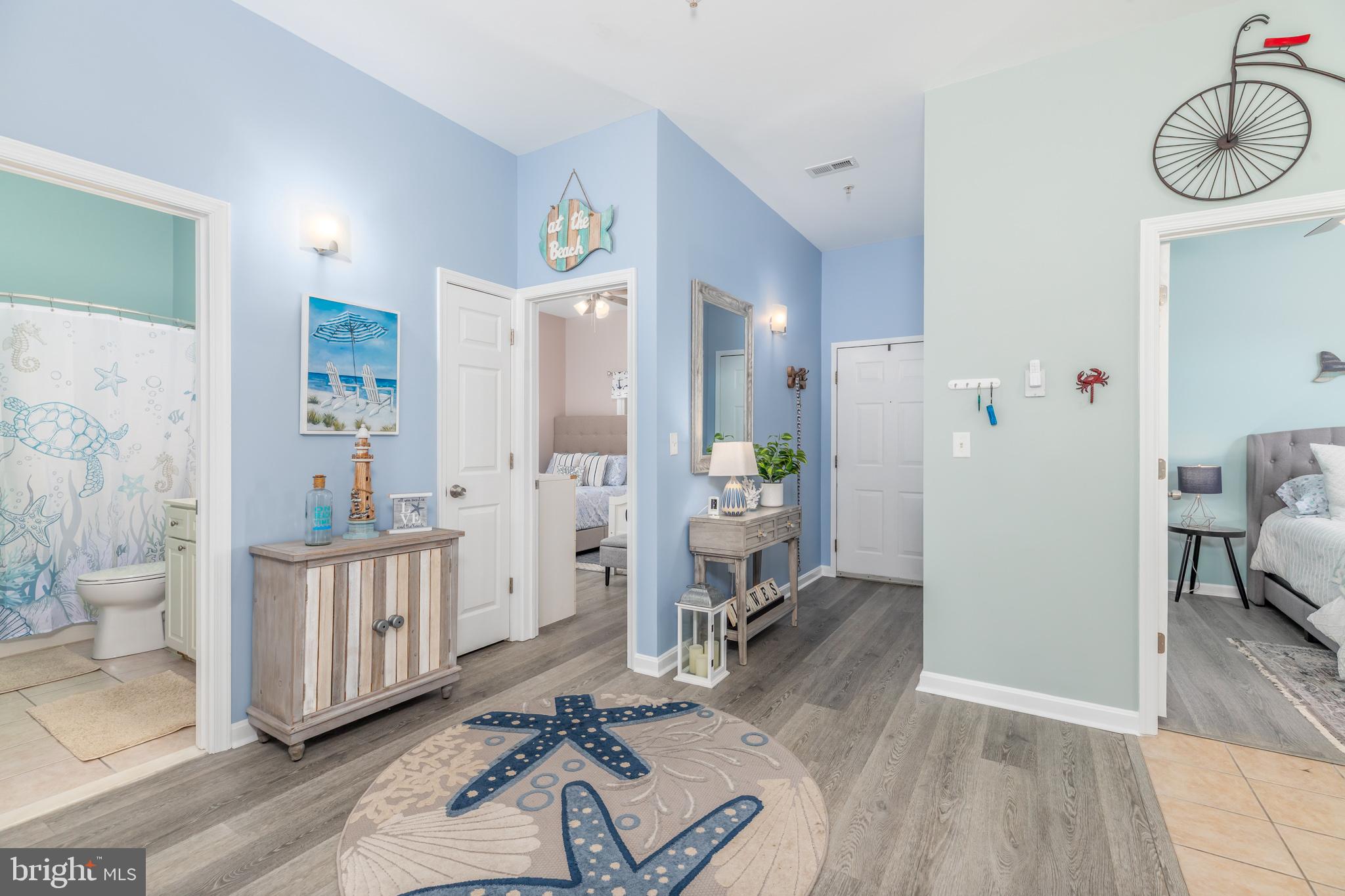 17300 North Village Main Boulevard, Unit 66 Lewes, DE 19958 - Photo 4 of 38 a living room with furniture and wooden floor