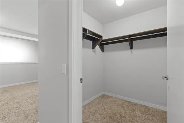 a bathroom with a toilet sink and shower