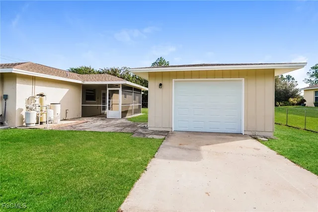 a view of a house with a backyard