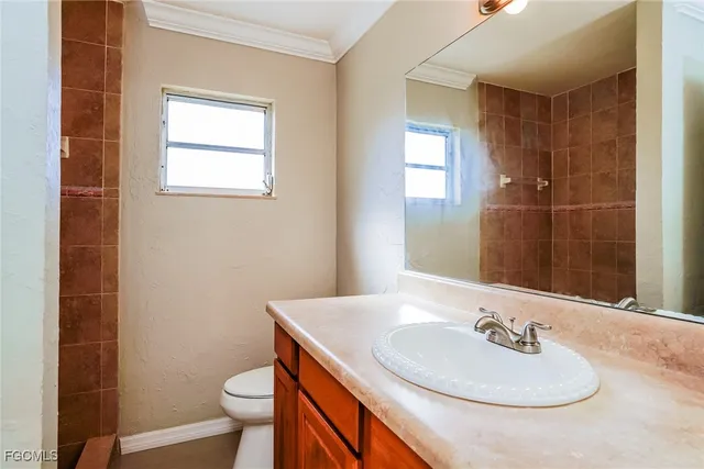 a view of room with window and ceiling fan