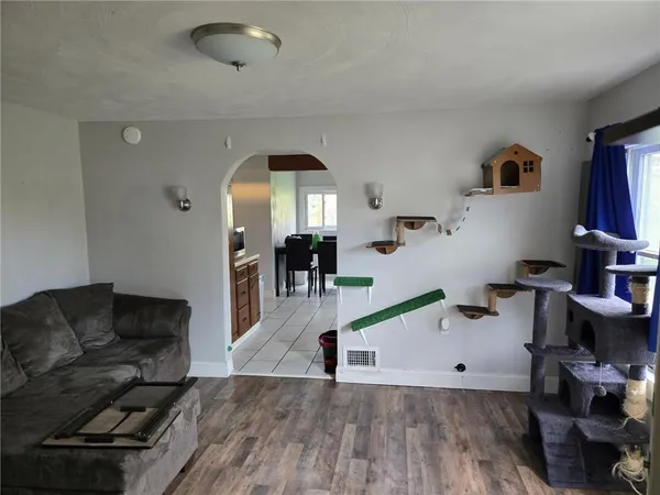 a bedroom with a bed and a large mirror