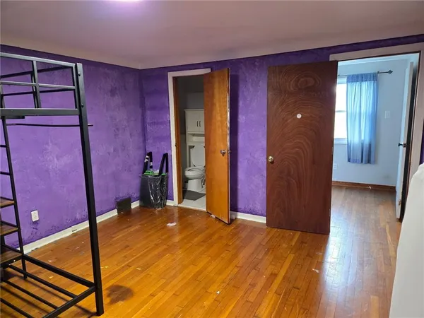 a bathroom with a sink a mirror a vanity and a shower