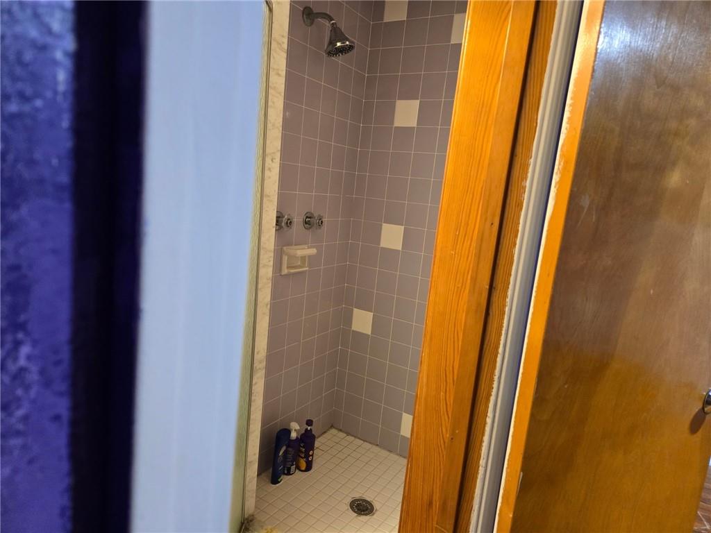 514 Penn High Park Road Jeannette, PA 15644 - Photo 25 of 30 a bathroom with a sink and a shower