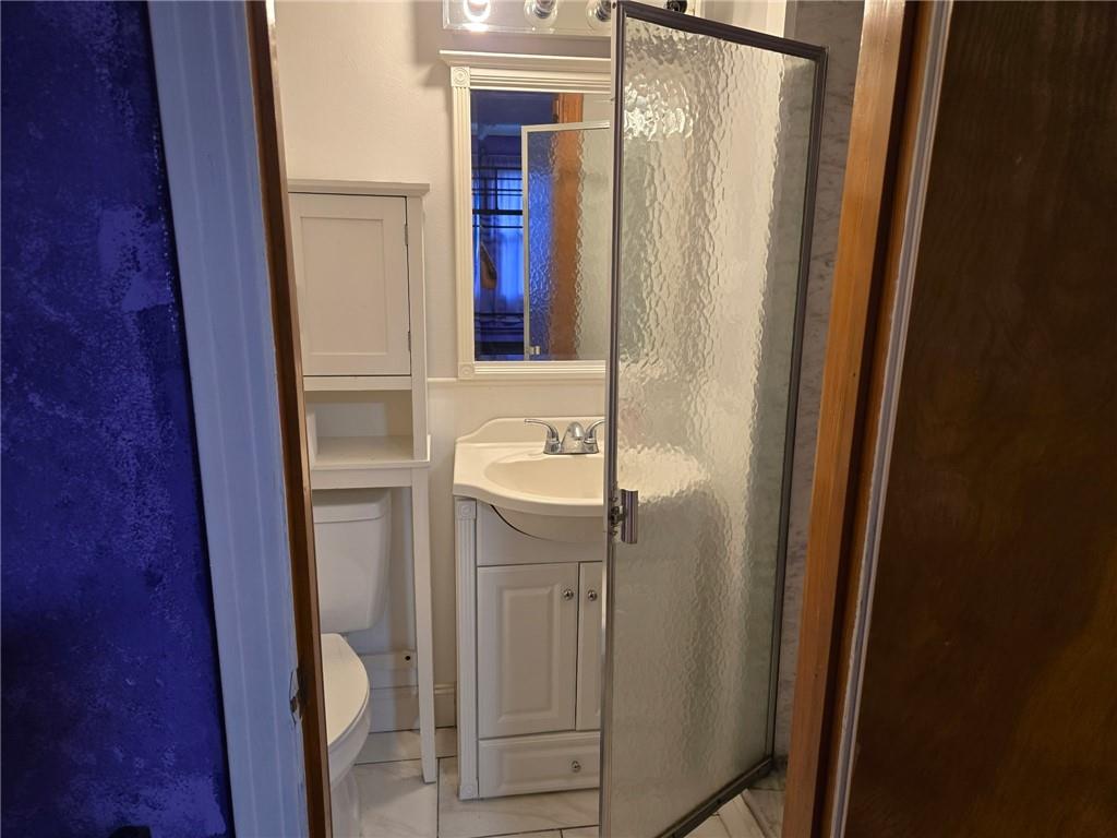 514 Penn High Park Road Jeannette, PA 15644 - Photo 27 of 30 a bathroom with a sink a mirror a vanity and a shower