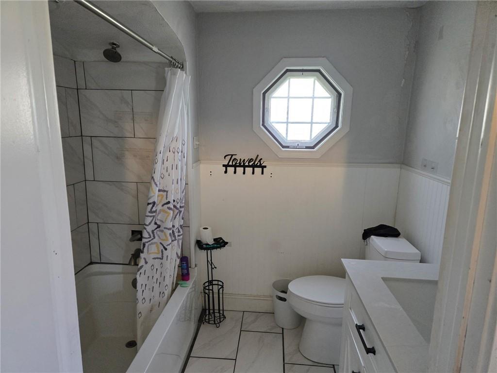 514 Penn High Park Road Jeannette, PA 15644 - Photo 28 of 30 a bathroom with a toilet and a mirror