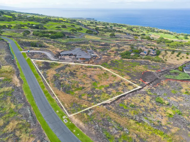 a view of an ocean and a mountain