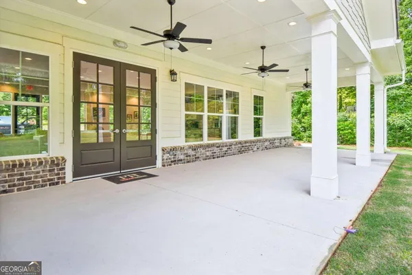 a view of an entryway with a floor to ceiling window and a floor to ceiling window