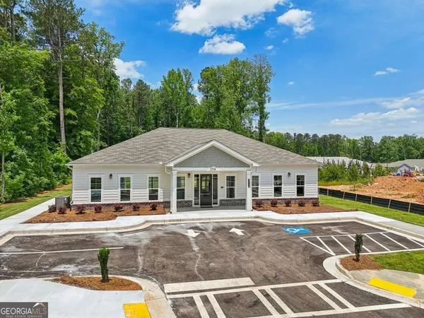 a front view of a house with a swimming pool