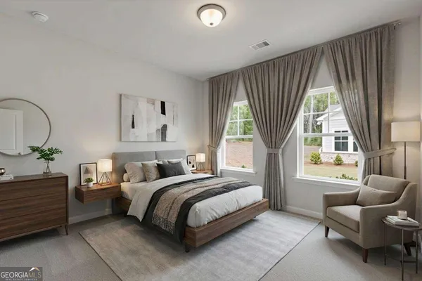a bedroom with a bed and a couch