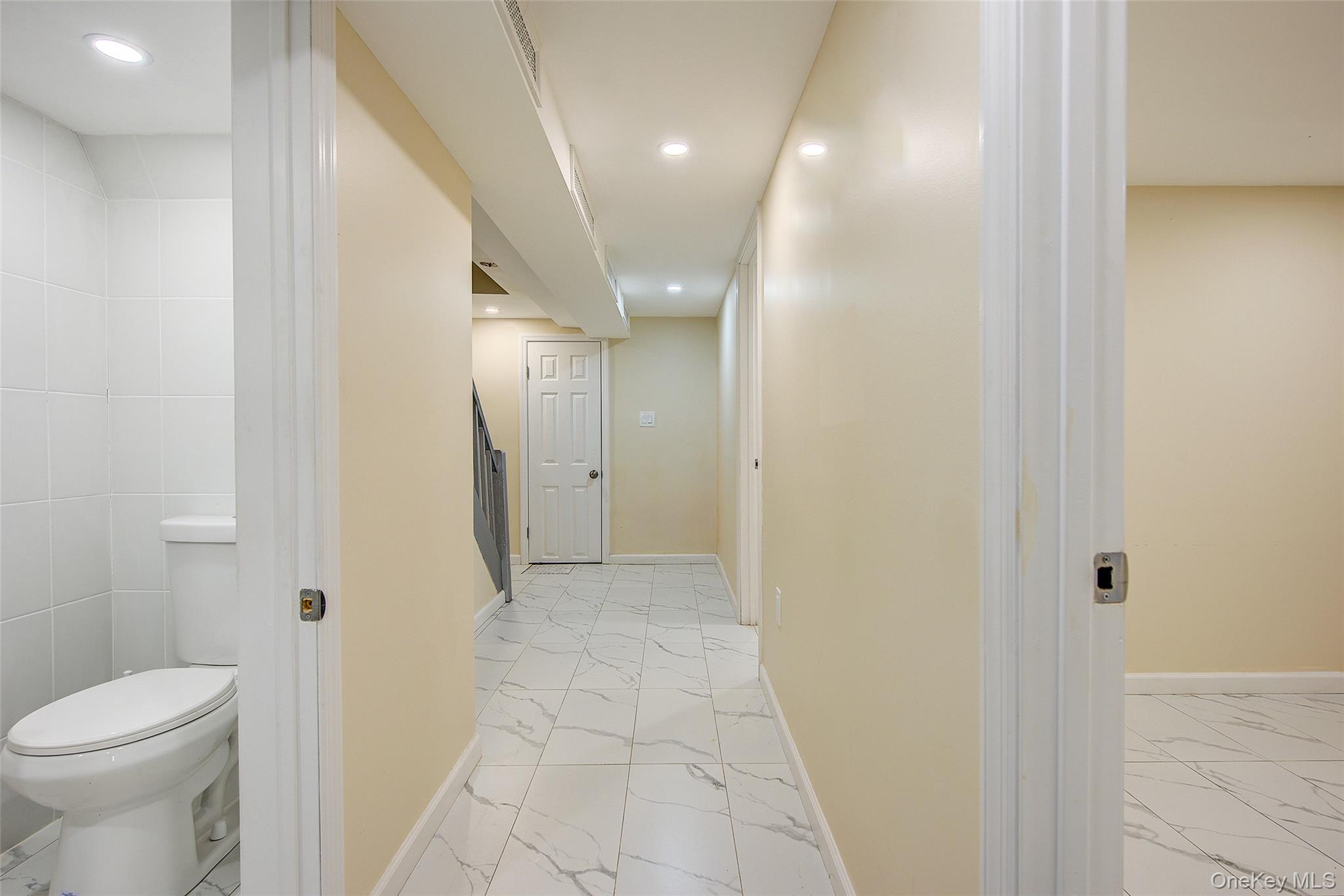 164-38 76th Road Queens, NY 11366 - Photo 34 of 44 a bathroom with a sink and a toilet