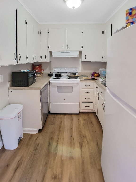 Undisclosed Address Raleigh, NC 27604 - Photo 15 of 32 a large white kitchen with granite countertop white cabinets and stainless steel appliances