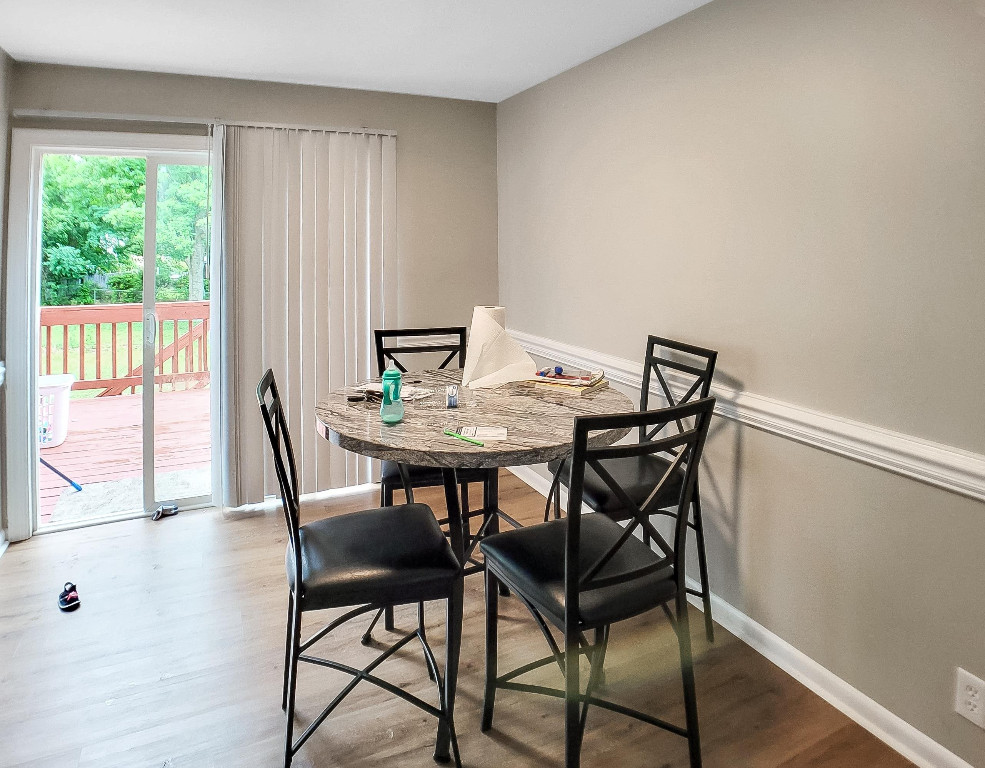 Undisclosed Address Raleigh, NC 27604 - Photo 16 of 32 a view of a dining room with furniture and wooden floor