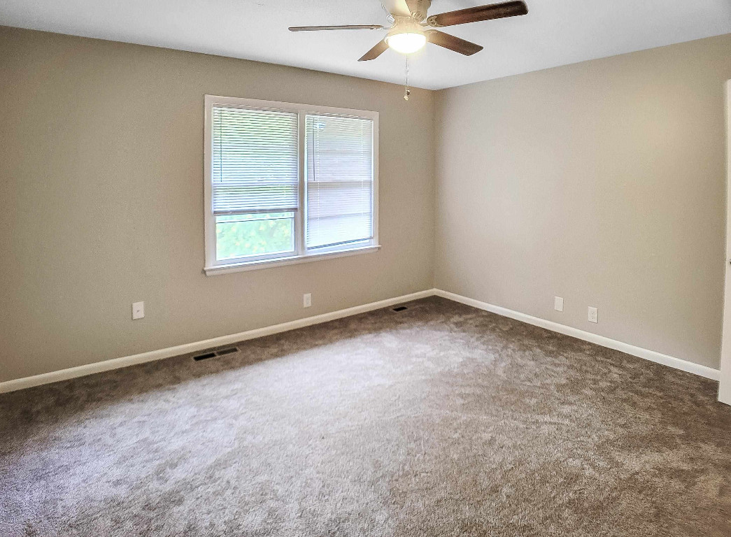 Undisclosed Address Raleigh, NC 27604 - Photo 20 of 32 an empty room with a window