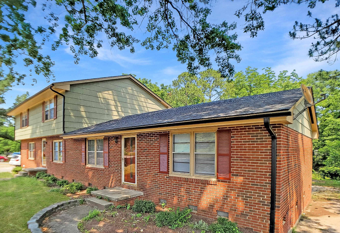 Undisclosed Address Raleigh, NC 27604 - Photo 2 of 32 front view of a house with a yard