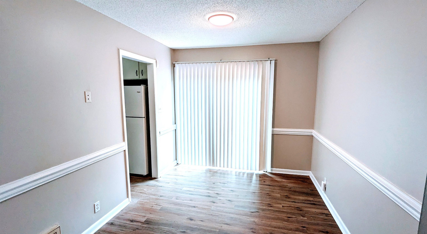 Undisclosed Address Raleigh, NC 27604 - Photo 23 of 32 a view of a hallway with wooden floor
