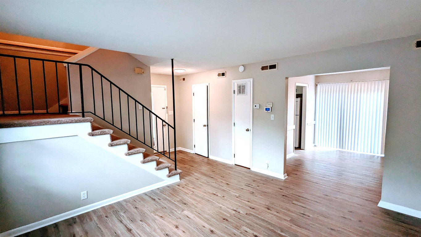 Undisclosed Address Raleigh, NC 27604 - Photo 25 of 32 a view of an entryway with wooden floor