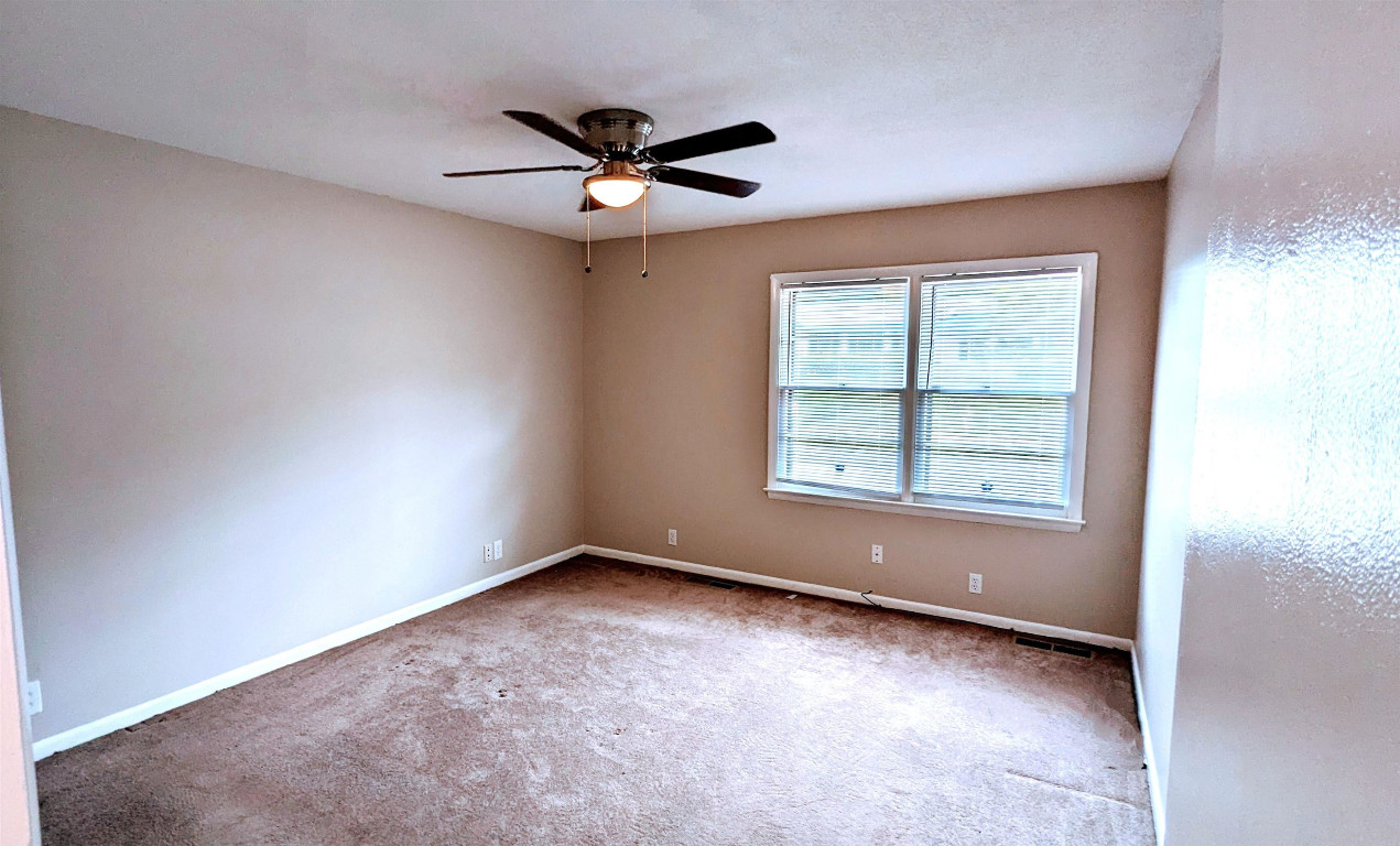 Undisclosed Address Raleigh, NC 27604 - Photo 31 of 32 wooden floor in an empty room with a window