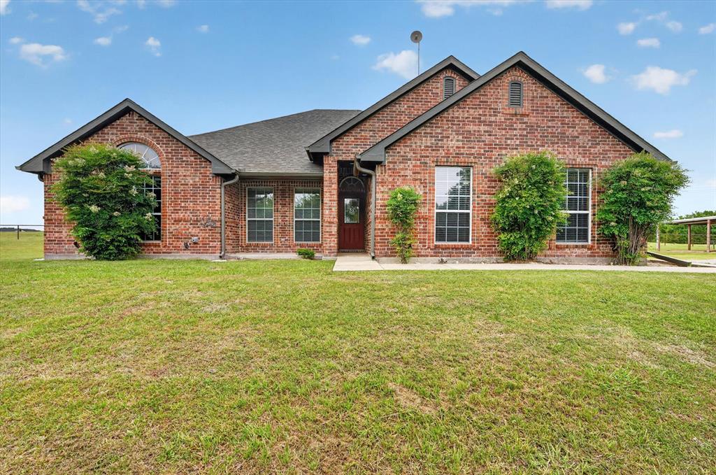 2828 Bennett Road Howe, TX 75459 - Photo 3 of 39 a front view of a house with garden