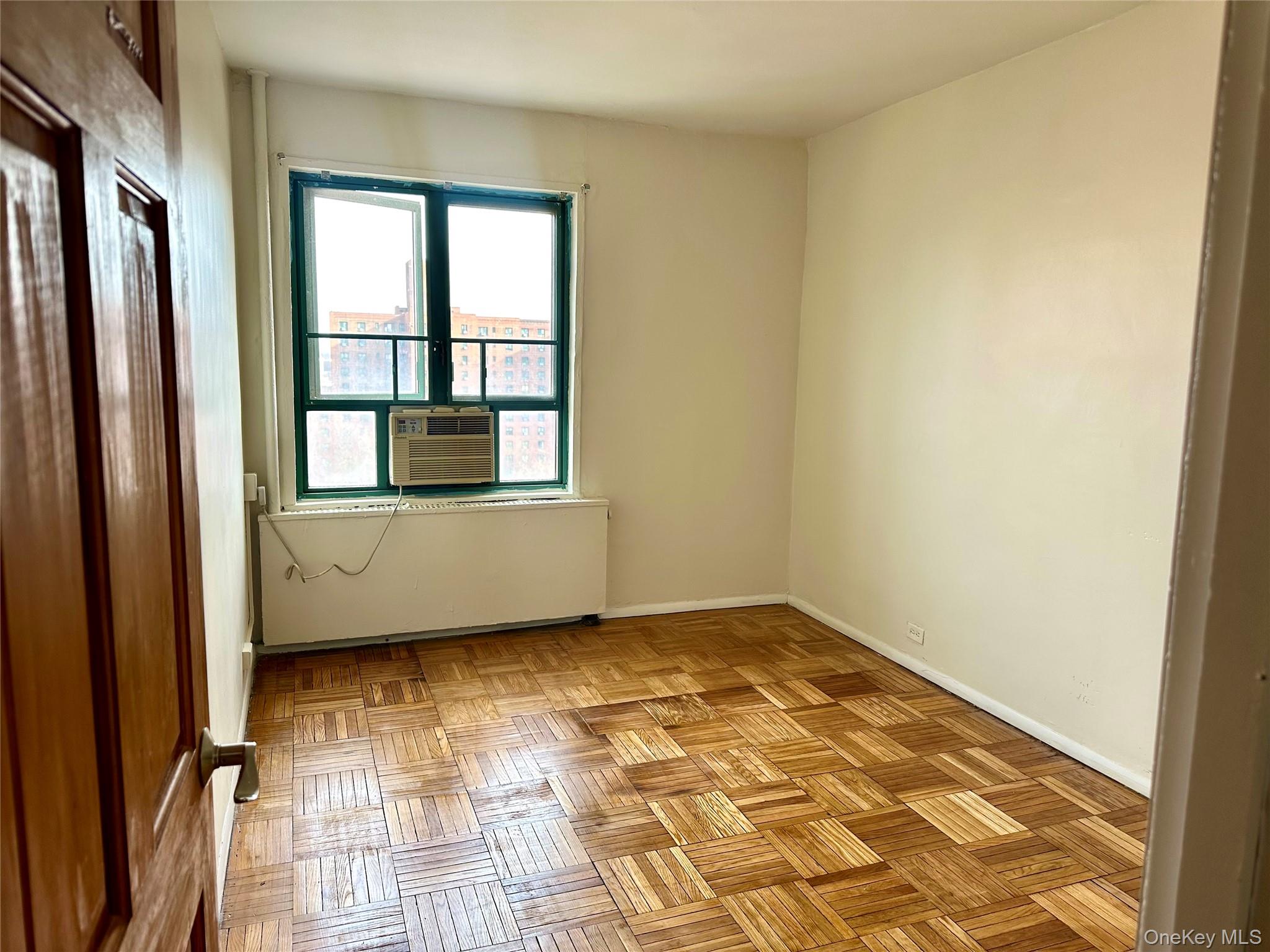 20 Metropolitan Ovl, Unit 11A Bronx, NY 10462 - Photo 11 of 16 Empty room featuring baseboards