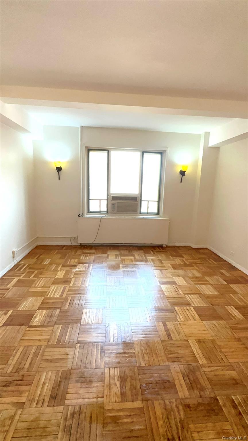 20 Metropolitan Ovl, Unit 11A Bronx, NY 10462 - Photo 13 of 16 Spare room with radiator heating unit and baseboards