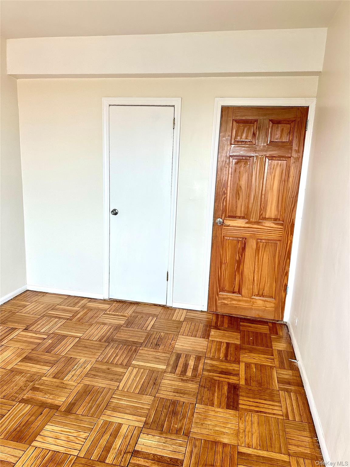 20 Metropolitan Ovl, Unit 11A Bronx, NY 10462 - Photo 8 of 16 Unfurnished bedroom with baseboards