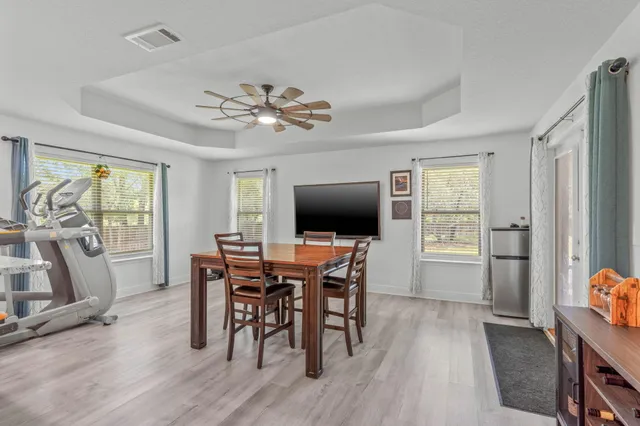 a view of a dining room with furniture window and wooden floor