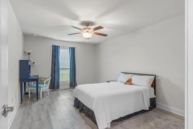 a bedroom with a bed and a table in it