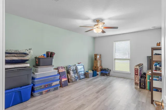 a bedroom with furniture and a chandelier