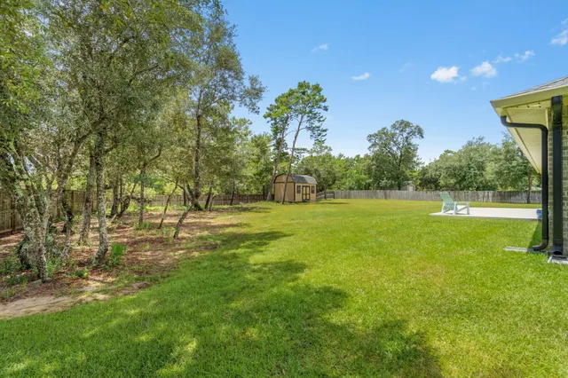 a view of swimming pool with a yard