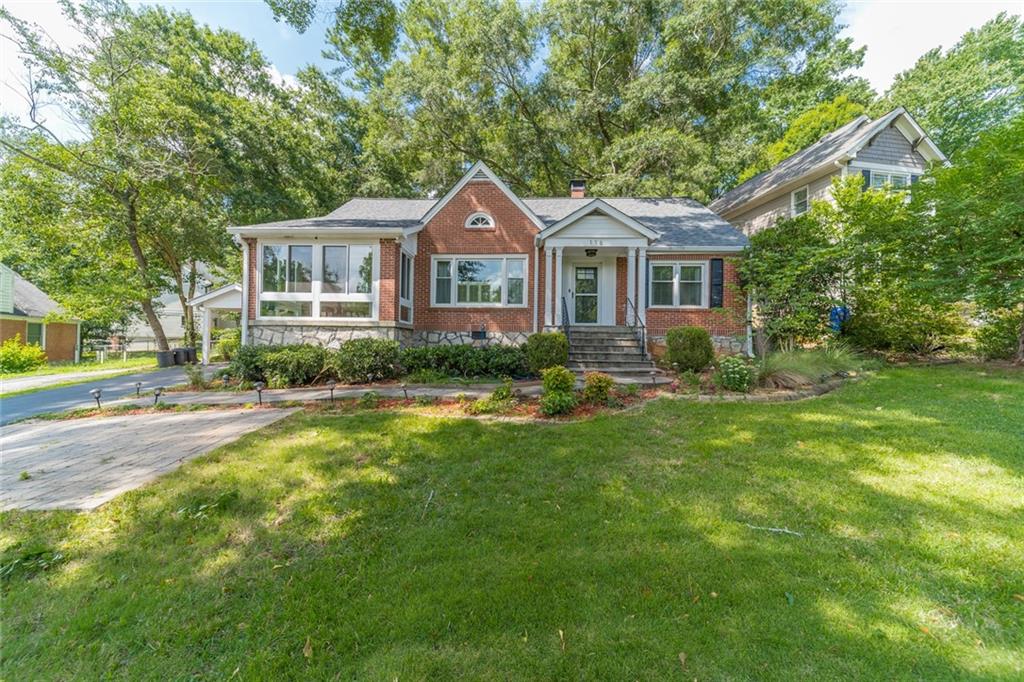 116 Midway Road Decatur, GA 30030 - Photo 1 of 1 a front view of a house with garden