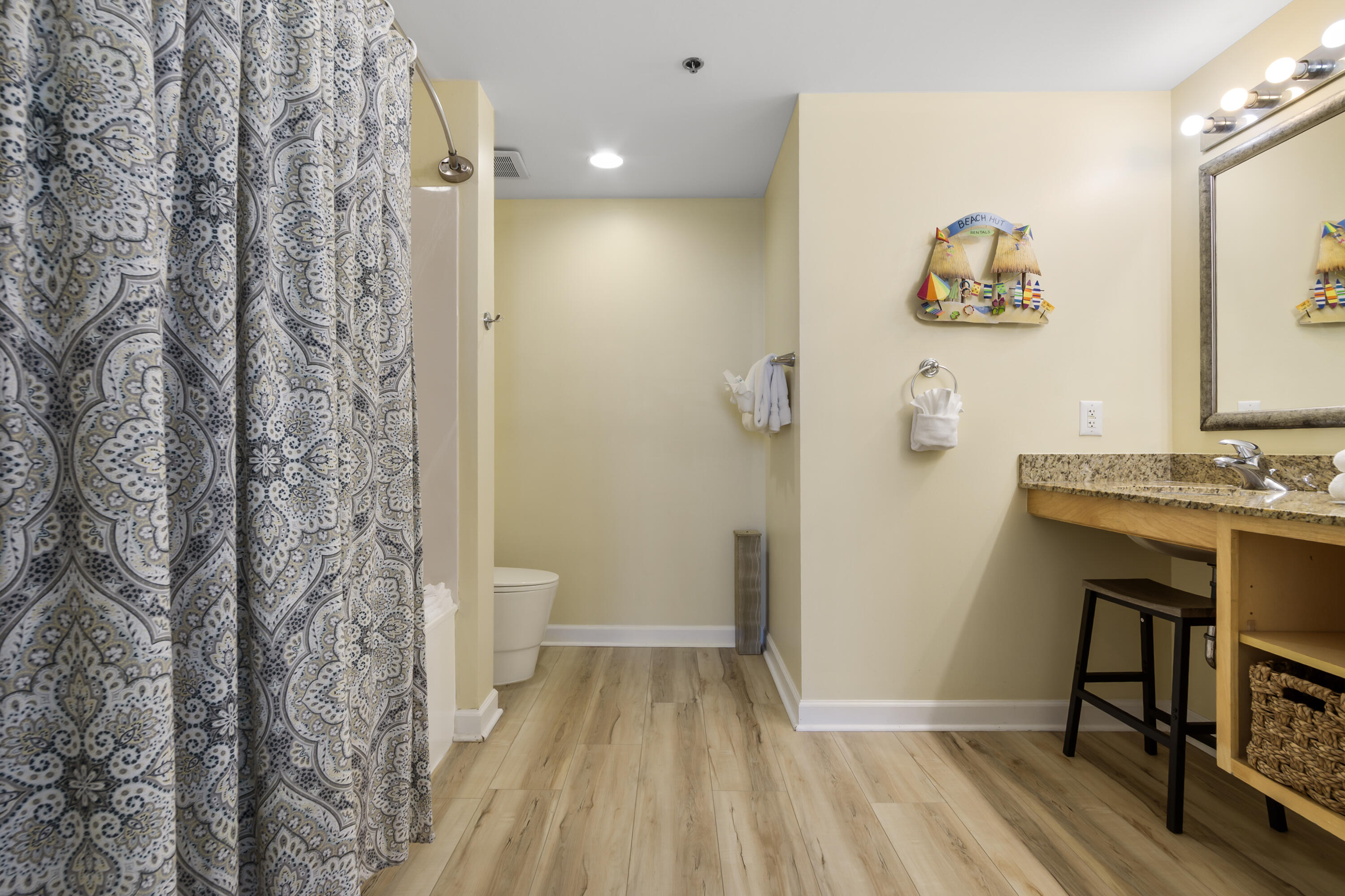17739 Front Beach Road, Unit 1902W Panama City Beach, FL 32413 - Photo 11 of 54 a bathroom with a sink and a mirror