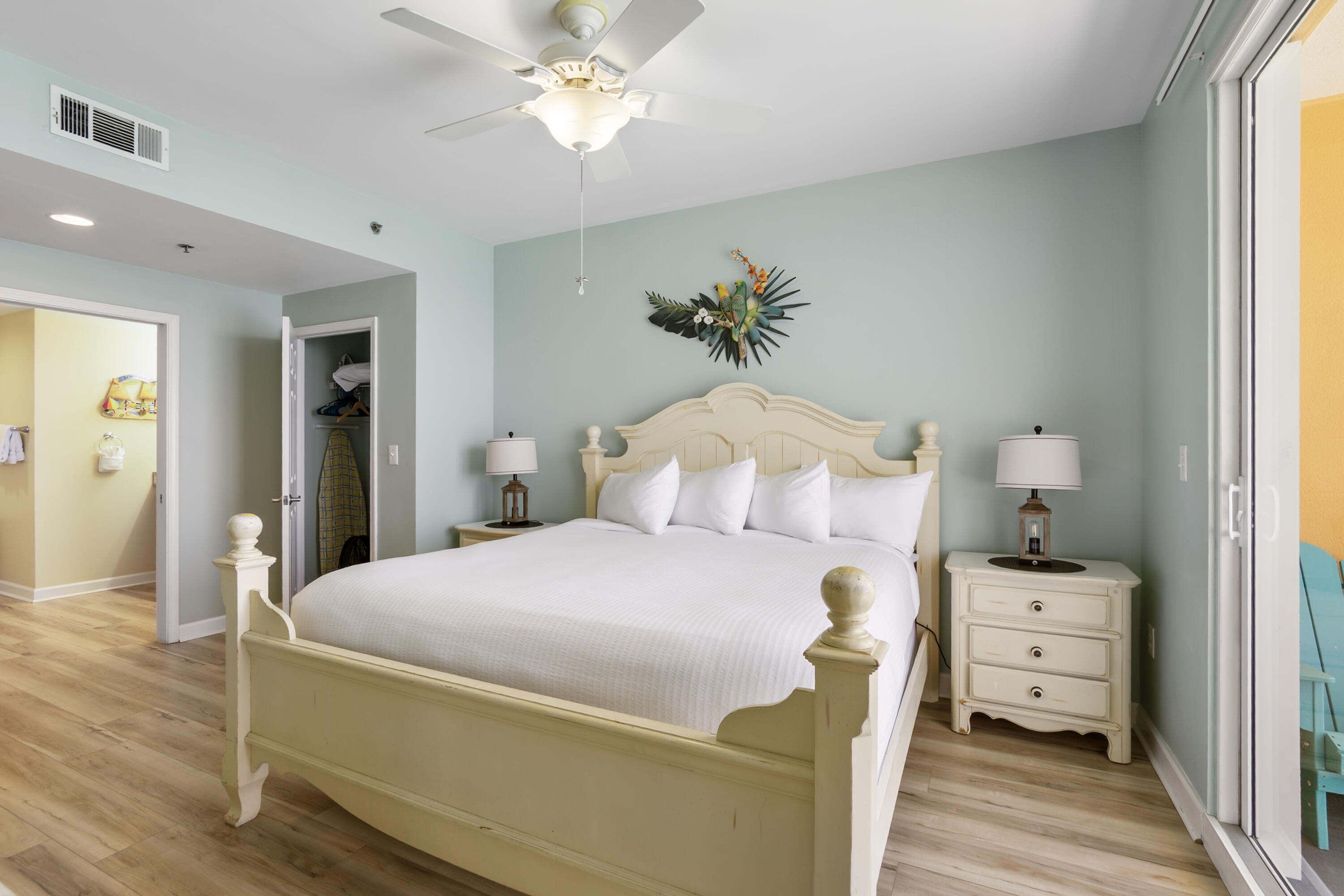 17739 Front Beach Road, Unit 1902W Panama City Beach, FL 32413 - Photo 21 of 54 a bedroom with a bed and wooden floor