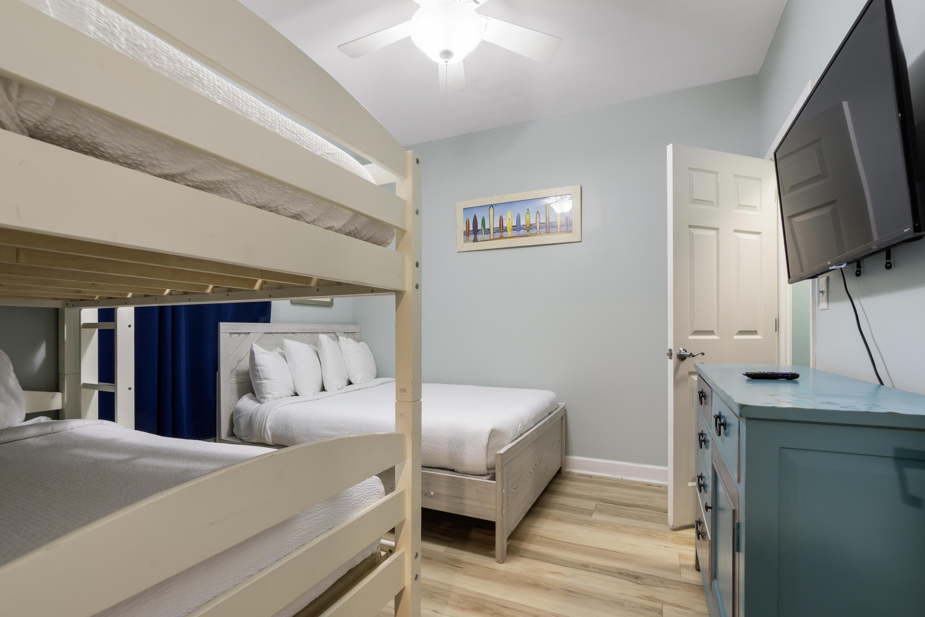 17739 Front Beach Road, Unit 1902W Panama City Beach, FL 32413 - Photo 26 of 54 a bedroom with a bed and a flat screen tv