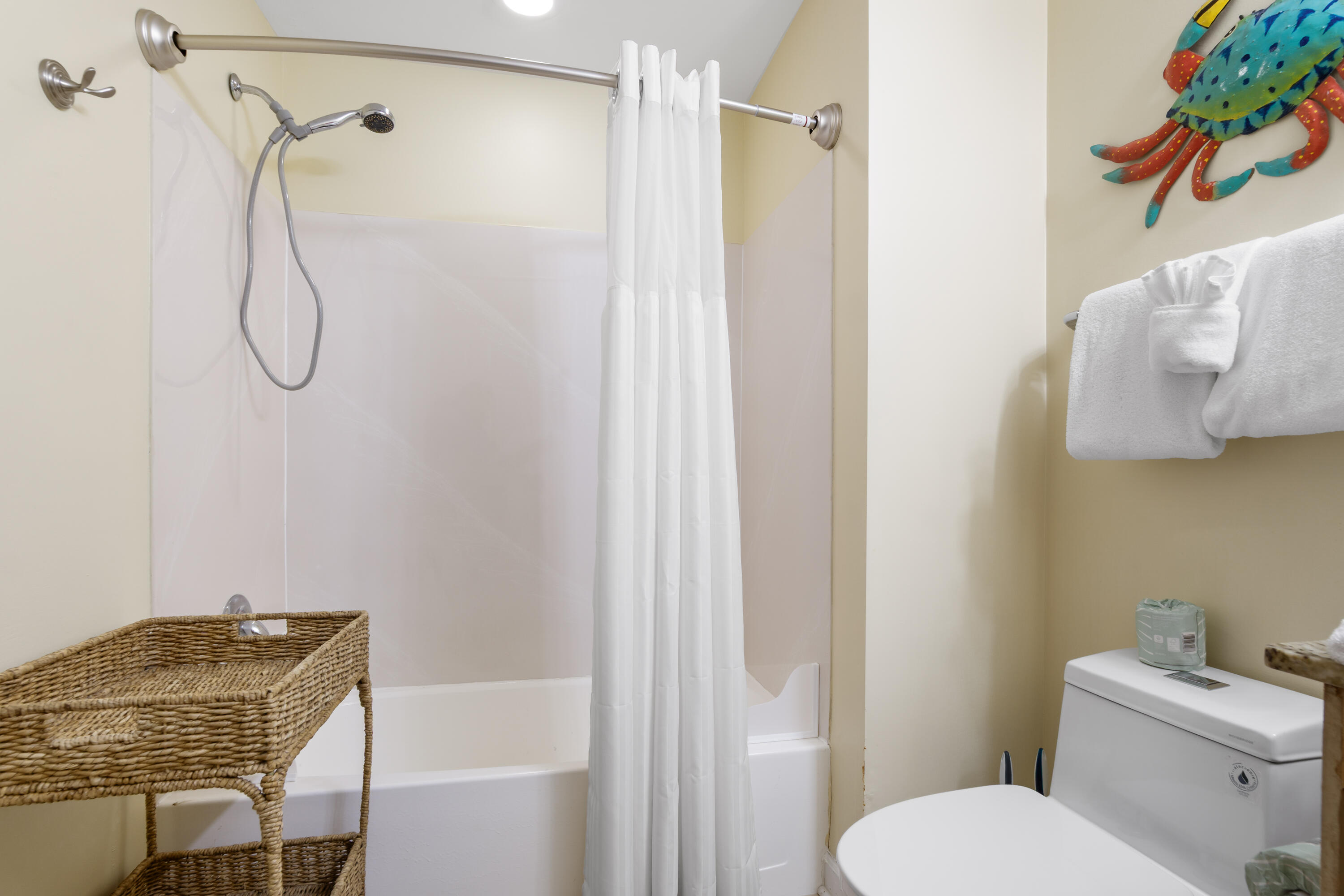 17739 Front Beach Road, Unit 1902W Panama City Beach, FL 32413 - Photo 29 of 54 a bathroom with a shower curtain and a sink