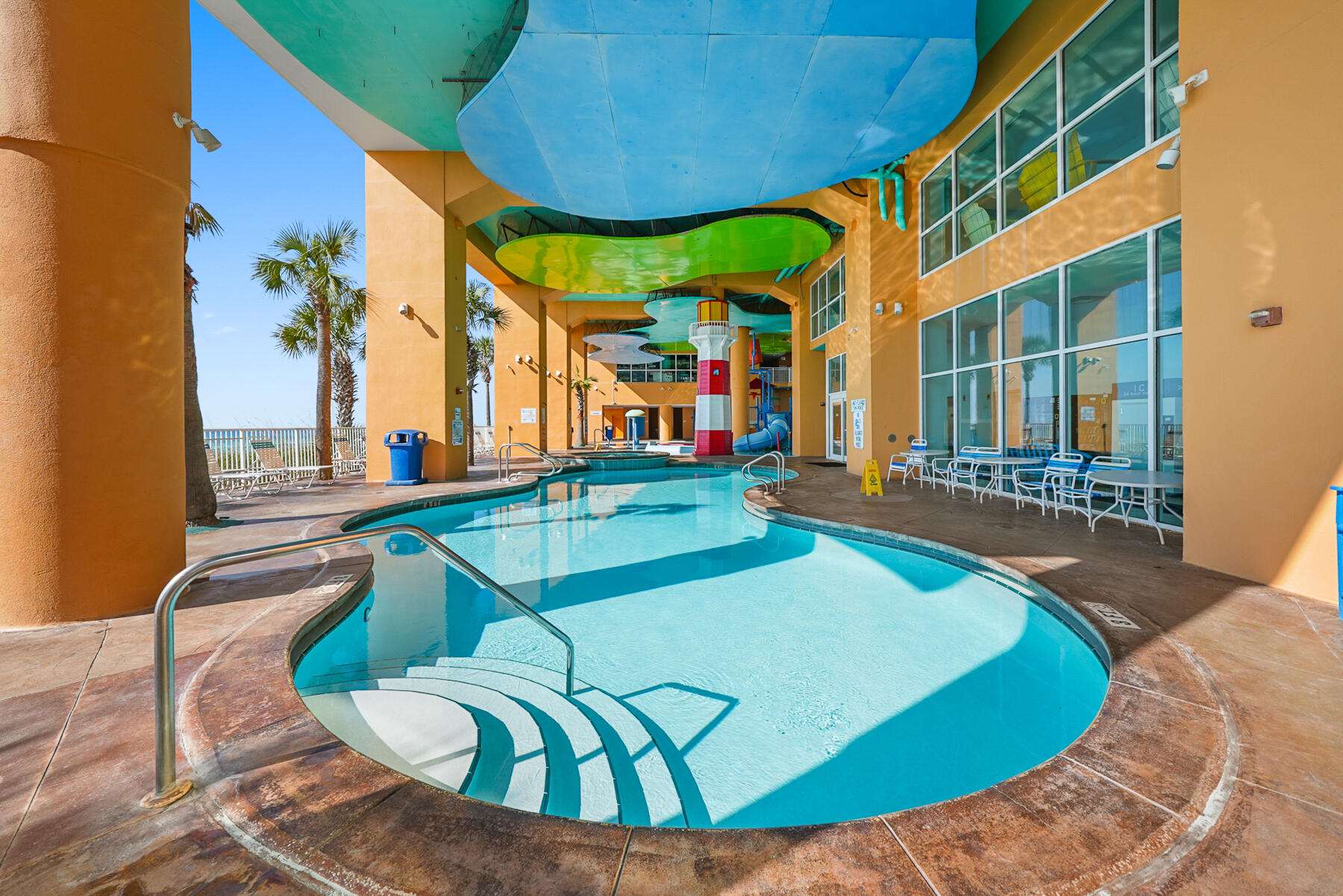 17739 Front Beach Road, Unit 1902W Panama City Beach, FL 32413 - Photo 33 of 54 a view of a swimming pool with chairs