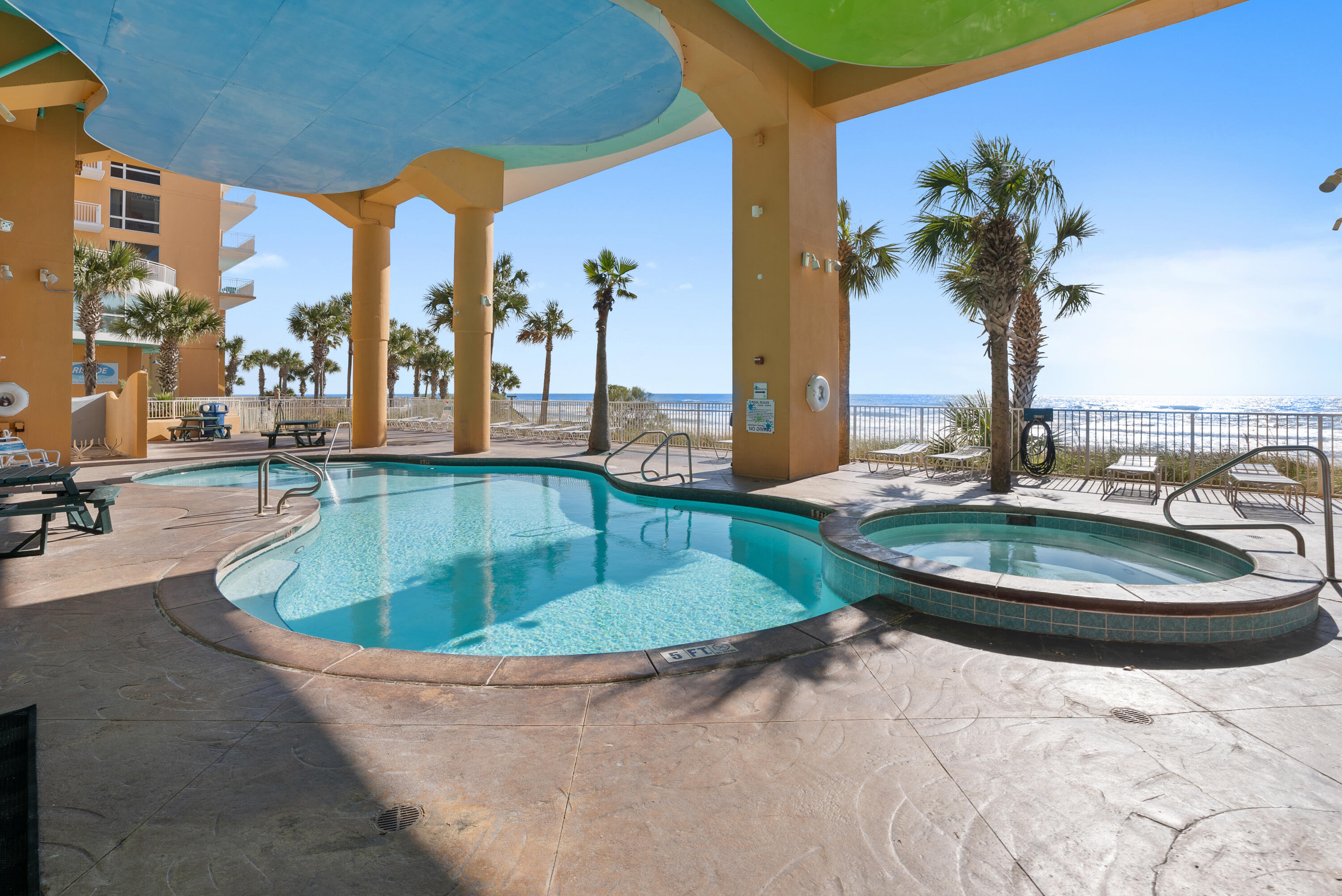 17739 Front Beach Road, Unit 1902W Panama City Beach, FL 32413 - Photo 36 of 54 a view of a swimming pool with a lounge chair