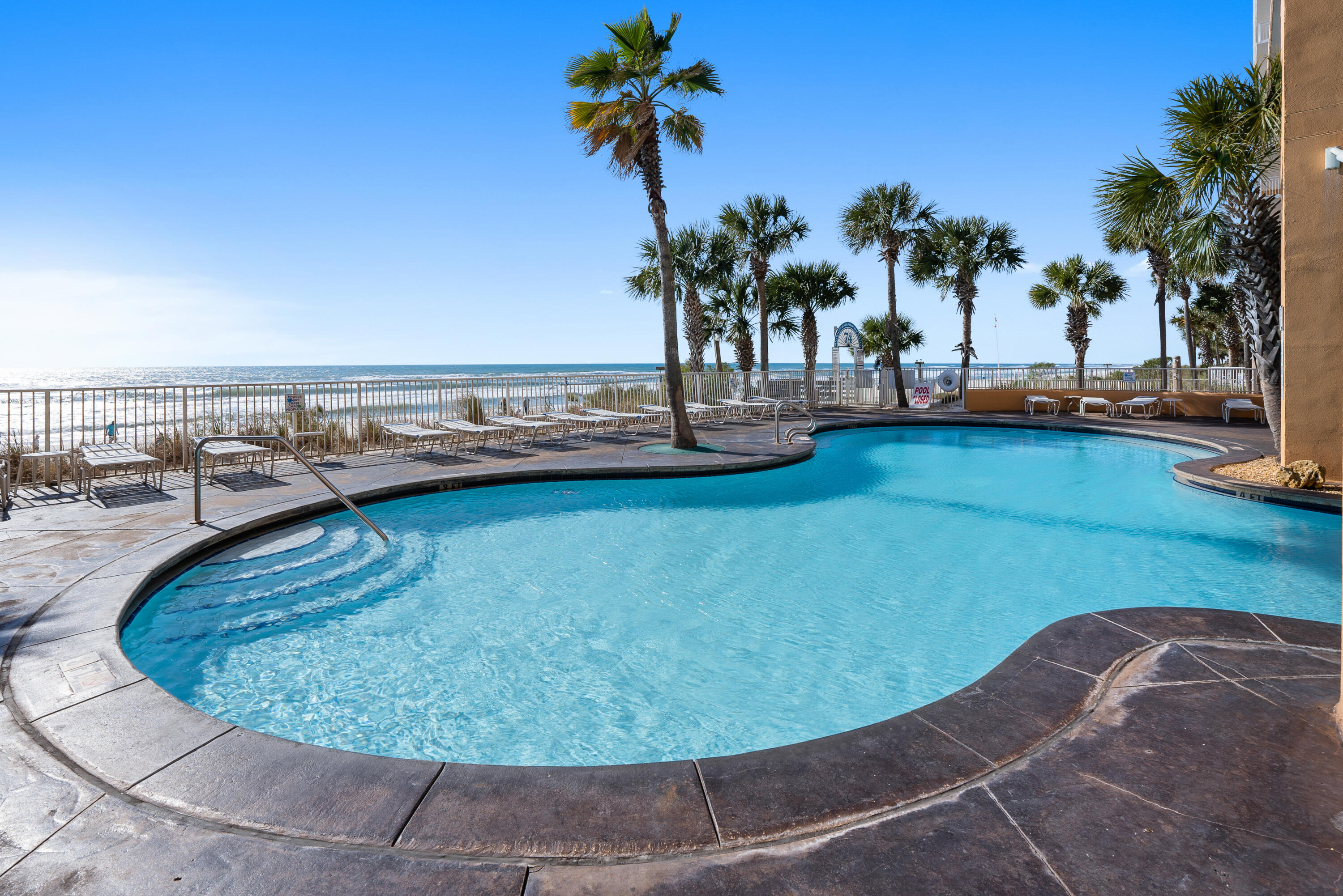 17739 Front Beach Road, Unit 1902W Panama City Beach, FL 32413 - Photo 39 of 54 a view of a swimming pool with outdoor seating