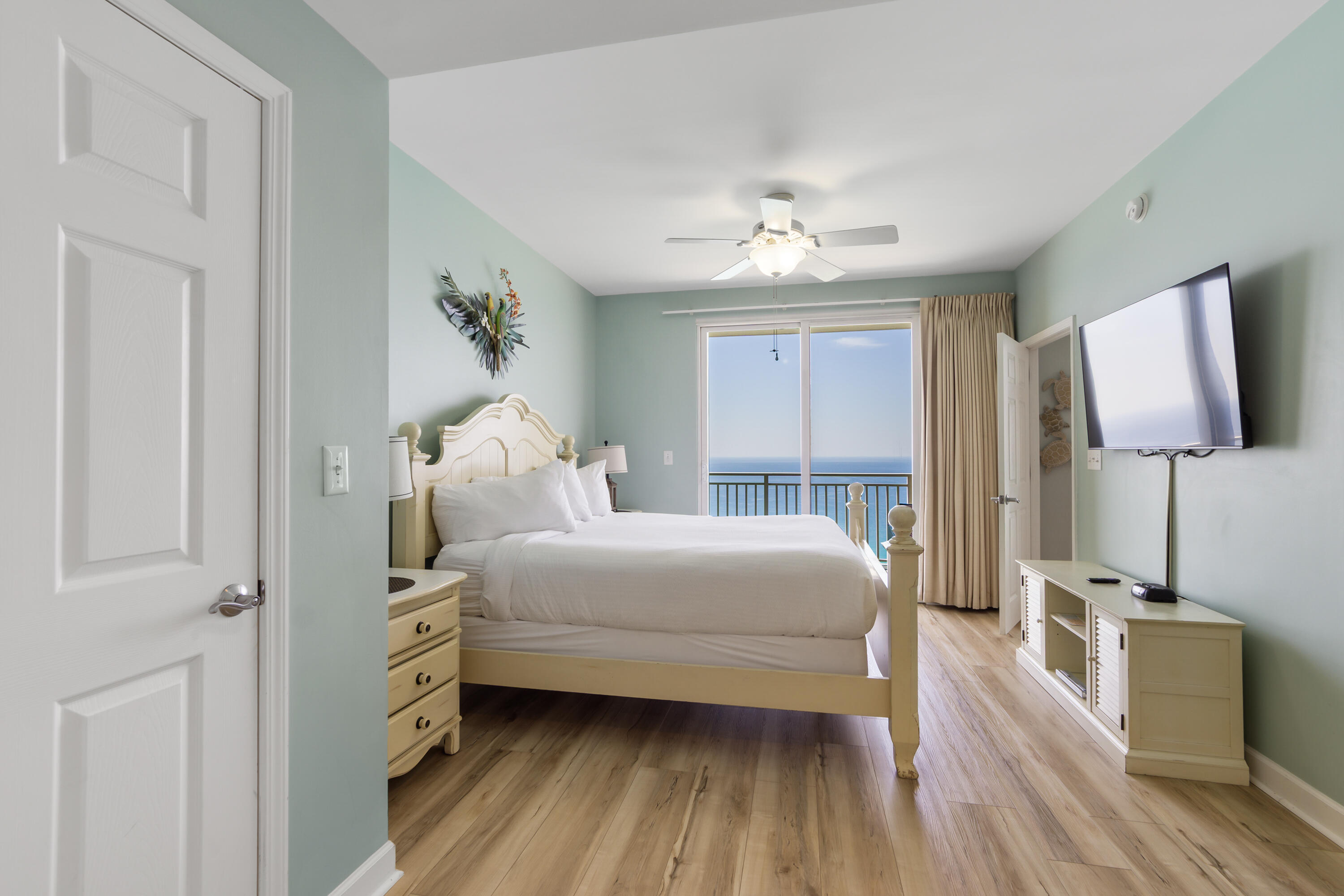 17739 Front Beach Road, Unit 1902W Panama City Beach, FL 32413 - Photo 6 of 54 a bedroom with a bed and a chandelier