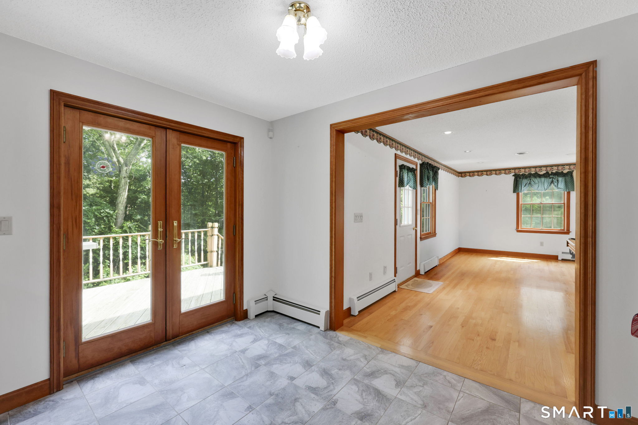 28 Heather Lane Coventry, CT 06238 - Photo 9 of 28 Kitchen French Doors leads to Deck