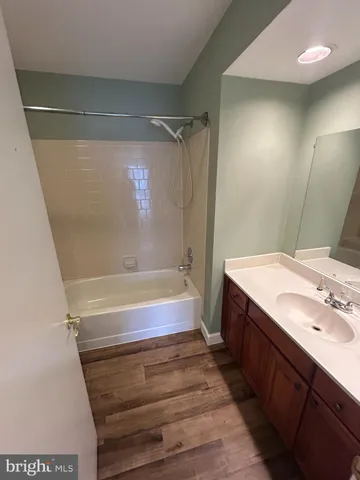 a bathroom with a toilet a sink a mirror and vanity