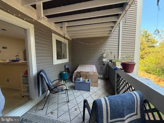 a view of a wooden balcony with wooden floor