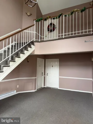 a view of staircase with a floor to ceiling window
