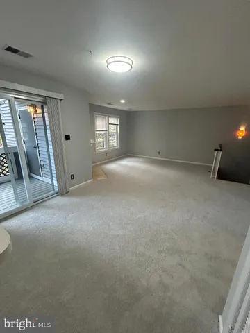 a view of a hallway with windows